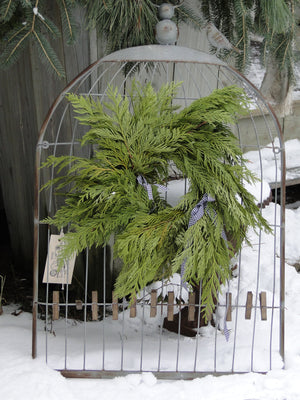 metal holder with cedar wreath